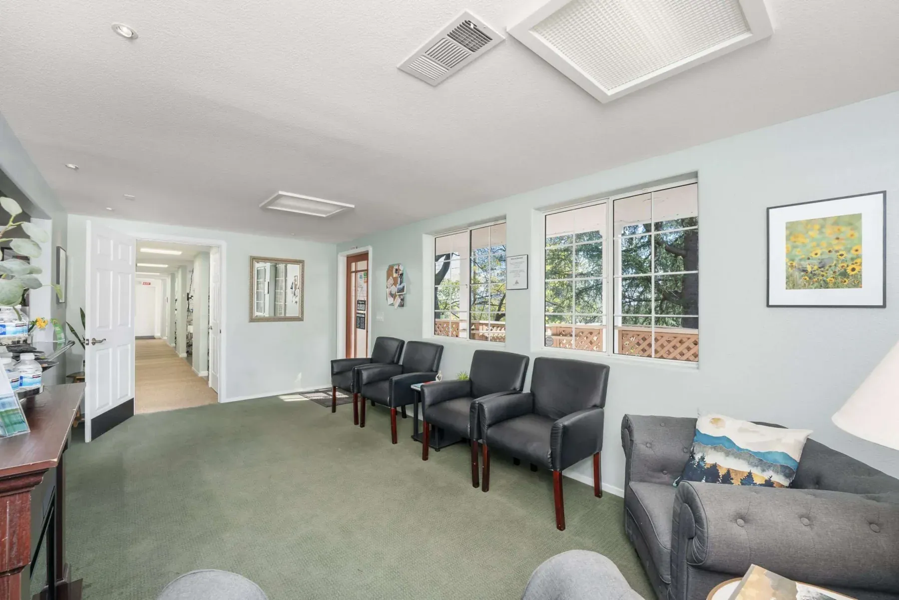 The bright, window-lined waiting room at Alta Vista Dental Care